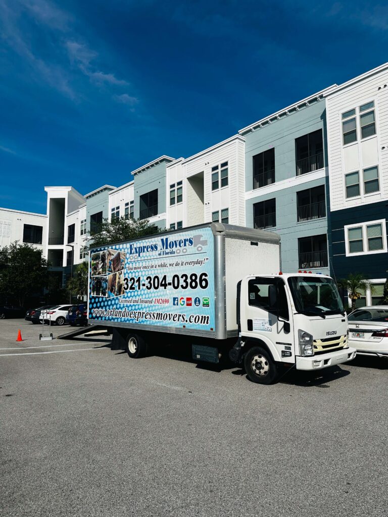 Orlando Express Movers truck parked outside an Orlando apartment complex